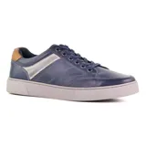 Zapato casual de cuero azul con detalles en marrón y plateado.