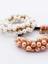 Pack de dos gomitas de pelo elásticas con cuentas de perlas blancas y color cobre.