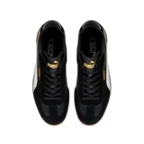 Championes Puma Club LI Era de cuero sintético negro con detalles en amarillo y suela color caramelo.