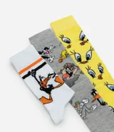 Kit de tres pares de medias de caña alta con diseños de los personajes de Looney Tunes: Bugs Bunny, Piolín y el Demonio de Tasmania.