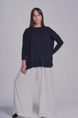 Sweater de punto color lila con diseño de ochos.