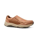Zapato casual marrón de cuero liso, sin cordones, con elásticos laterales y suela de goma color beige.