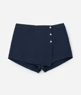 Short pollera azul marino de sarga de algodón, con tres botones dorados en el frente. Corte evasé.