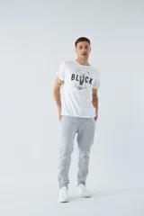 Pantalón de felpa gris para hombre con logo estampado y en goma, bolsillos con cierre, cierres en los tobillos, cintura ajustable y puños.