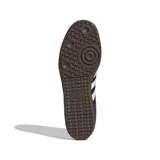 Zapatillas bajas negras con detalles en blanco, diseño clásico y suela de goma.