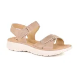 Sandalias bajas color beige con ajuste de velcro en el tobillo y en el empeine.