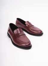 Mocasines negros de cuero con detalle de antifaz y suela plana. Interior con logo de la marca LSF2Y estampado en plateado.