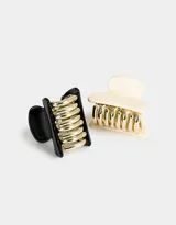 Set de dos broches para el pelo tipo pinza, uno color crema y otro negro, ambos con dientes dorados.