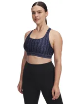 Top deportivo Under Armour con estampado abstracto en tonos de azul y gris. Cuenta con breteles anchos cruzados en la espalda y banda elástica con el logo de la marca.