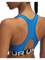 Top deportivo Under Armour color azul con logo de la marca en el frente y espalda deportiva. Banda inferior elástica con la inscripción "Under Armour".