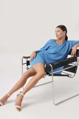 Shorts tipo biker de tejido de punto color beige melange, ajustados al cuerpo.