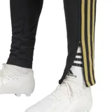 Pantalón de fútbol Adidas Messi negro con detalles en dorado y blanco.