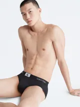 Slip negro Calvin Klein 1996 de microfibra con logo estampado en toda la prenda y cintura elástica distintiva.