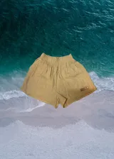 Short color crema de muselina con cintura elástica y logo bordado en la pierna.