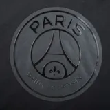 Canguro negro con capucha y cordones, con logo del Paris Saint-Germain estampado en el pecho.