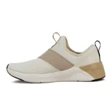 Championes Puma Softride Harli Slip On para mujer, color crudo y beige, sin cordones, con capellada de malla y banda elástica cruzada en el empeine.