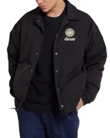 Campera tipo coach color verde con logo de la marca Deus en el pecho.