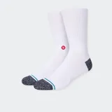 Medias blancas de caña media con puntera y talón en color gris jaspeado. Presentan una línea horizontal verde y logo de la marca en rojo.