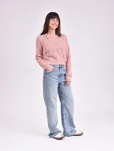 Sweater de punto calado color crudo, de corte holgado y mangas largas.