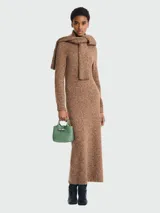 Bolso Longchamp modelo Le Roseau XS, color verde claro, con doble asa corta y cierre de broche metálico.