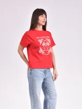 Remera celeste de algodón con estampado de flor y texto "Real View".