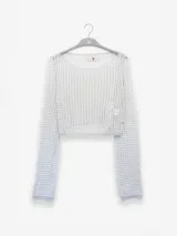 Sweater corto tejido con tres hilos de distintos tonos, uno de ellos con lurex.