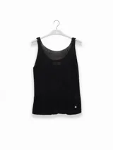 Musculosa tejida en hilo de lurex color dorado, con escote redondo y logo de Polonio en cobre.