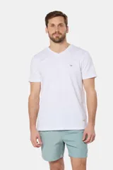 Short de baño azul vibrante, de corte clásico y largo medio, con cintura elástica y cordón ajustable. Cuenta con bolsillos laterales y suspensor de malla fina interior.