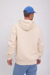 Canguro color crema con capucha y cordones ajustables. Estampado en relieve con la palabra "ORIGINAL" y el logo de la marca Jack & Jones.