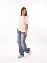 Remera color ladrillo con estampado de olas y texto "Waves of Life" en blanco.