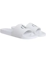 Ojotas blancas de Calvin Klein Jeans con logo CK en la tira.