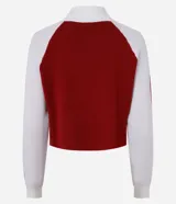 Suéter corto de punto con cuello alto y medio cierre con cremallera. Tiene mangas largas con sisa raglán y lettering "London" en el frente.