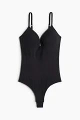 Body colaless negro de punto con efecto push-up, leve efecto moldeador en cintura y caderas, breteles ajustables, copas acolchadas sin aros y refuerzo interior con botones a presión ocultos.