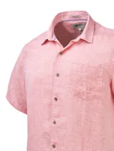 Camisa de manga corta color verde agua, confeccionada en lino orgánico. Tiene cuello italiano, calce regular y cierre con botones.