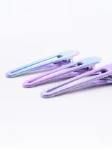 Pack de tres pinzas para el pelo con diseño iridiscente.