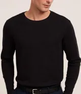 Remera de manga larga color crema, confeccionada en tejido waffle de algodón y poliéster.