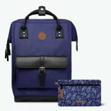 Mochila Cabaia Adventurer Dusseldorf color violeta con detalles en negro. Tiene sistema MOLLE, compartimento acolchado para tablet o PC, correa para sujetar a la maleta y tirantes acolchados antitranspirantes.