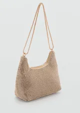 Bolso de mano dorado con apliques de cristales facetados, doble asa corta y asa larga de cadena.