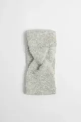 Vincha de punto color gris melange con nudo frontal.