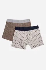 Pack de dos bóxers estampados, uno con diseño geométrico en tonos marrones y cintura elástica negra, y otro con estampado floral en tonos azules y cintura elástica gris.
