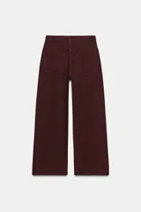 Pantalón de jean negro con efecto lavado, corte wide leg y tiro alto.