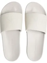 Ojotas Calvin Klein Jeans color blanco, con tira ancha de lona con logo CK en relieve y plantilla con logo de la marca.