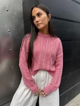 Sweater tejido de punto color rosa con diseño de ochos.
