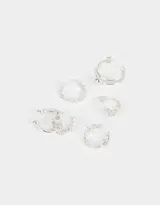 Set de seis earcuffs dorados con diferentes diseños.
