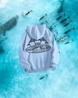 Hoodie celeste con estampado de dos delfines, el logo GW y la frase "Glassy Waves".