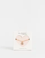 Cadena corta dorada con dije de la letra A cubierto de strass.