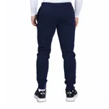 Pantalón de jogging negro de felpa con puños y logo de Umbro estampado en blanco.