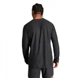 Remera deportiva Adidas Own The Run de manga larga, color negro con tres tiras blancas en los hombros y logo blanco en el pecho.