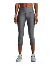 Calza capri Under Armour HeatGear color gris, de tiro alto y calce ajustado. Cuenta con bolsillo lateral y logo estampado en la pierna.