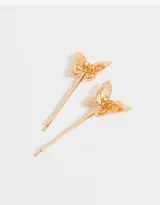 Set de dos horquillas doradas para el pelo con apliques de mariposas caladas y strass.